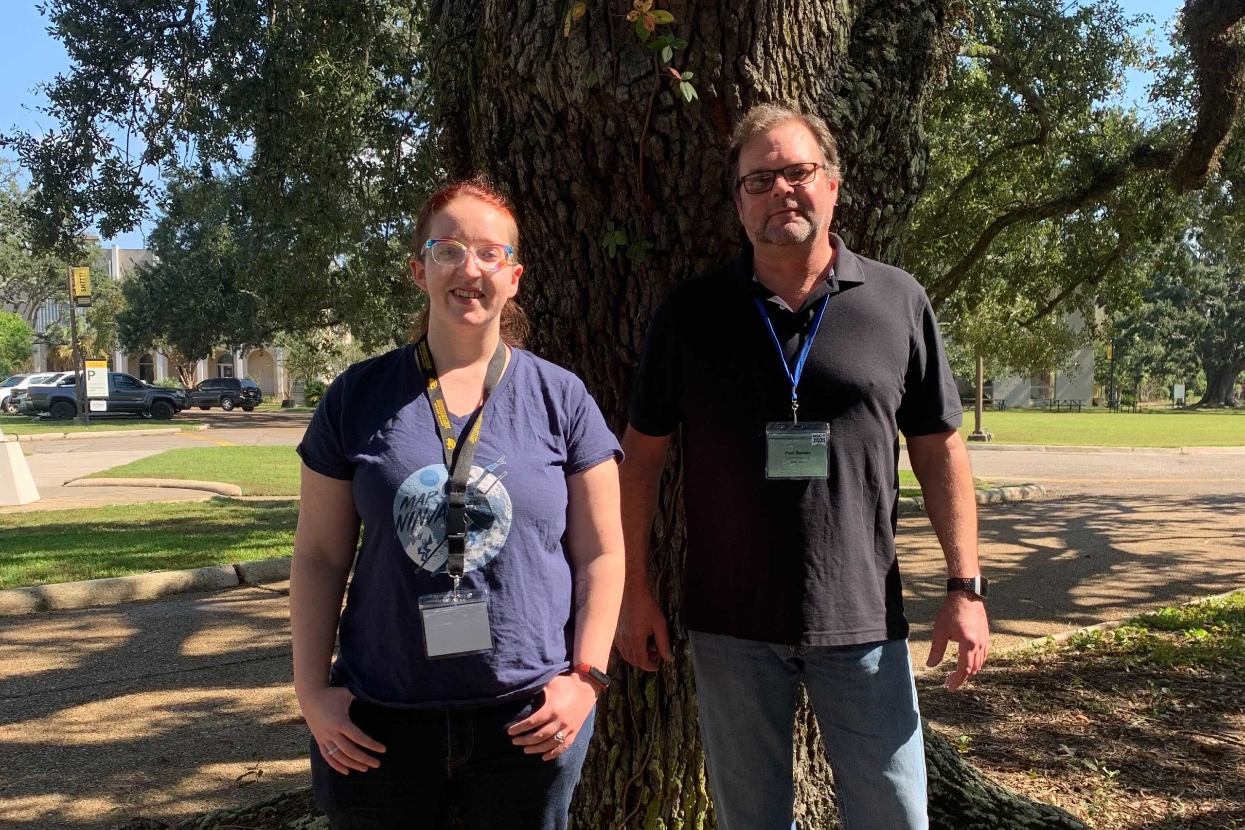 Courtney Menikheim and Paul Barnes stand before an oak tree at the University of Southern Mississippi Gulf Park campus. They are both facing the camera and smiling.